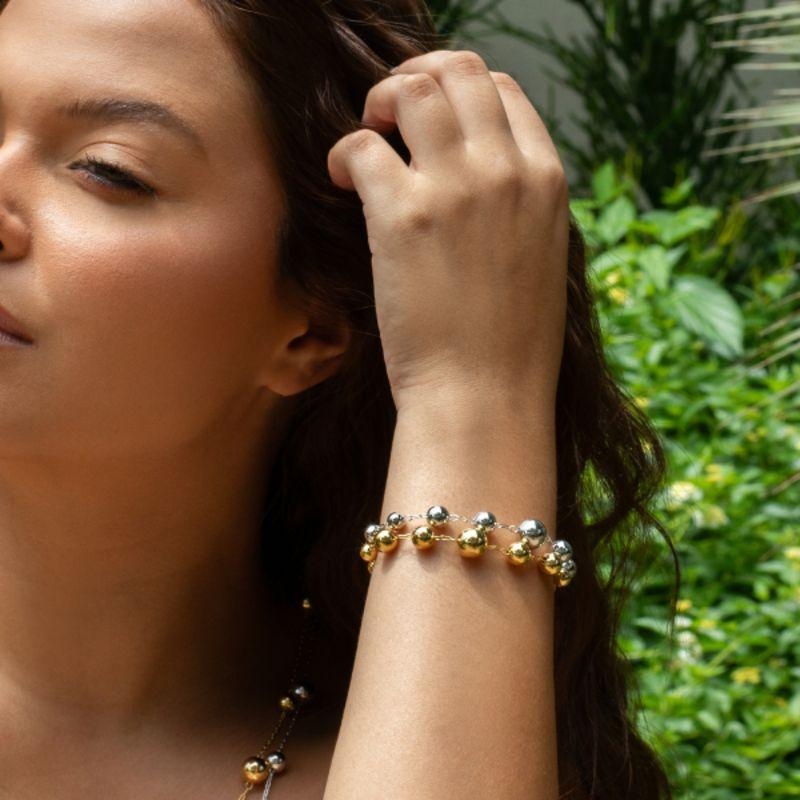 PULSEIRA ORB GLOW: ESFERAS POLIDAS EM BANHO DE OURO 18K
