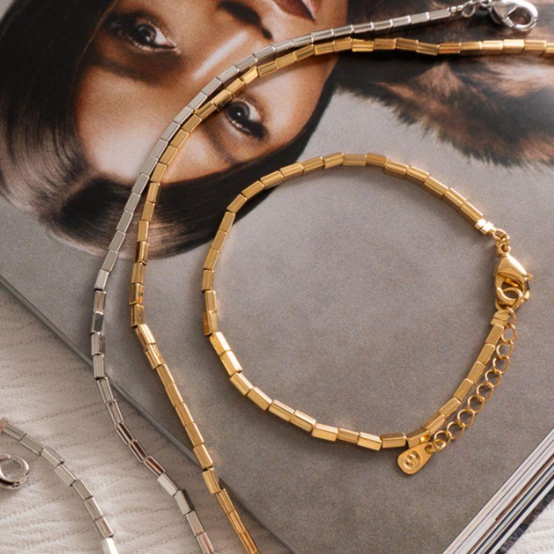 PULSEIRA MALHA DE CANUTILHOS METÁLICOS - BANHO DE OURO 18K