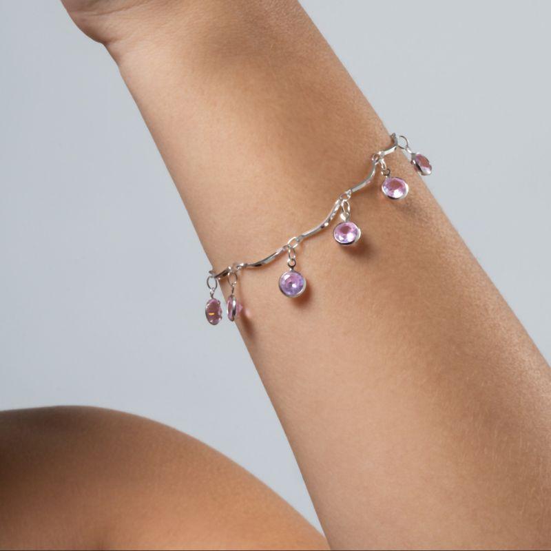 PULSEIRA RÍGIDA COM PINGENTES DE ZIRCÔNIA ROSA EM RÓDIO BRANCO
