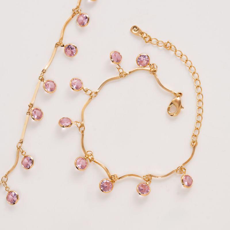PULSEIRA RÍGIDA COM PINGENTES DE ZIRCÔNIA ROSA EM BANHO DE OURO 18K